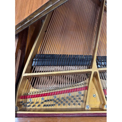 5 - Steinway (c1922)A 5ft 10in Model O grand piano in a rosewood case on square tapered legs; together w... 