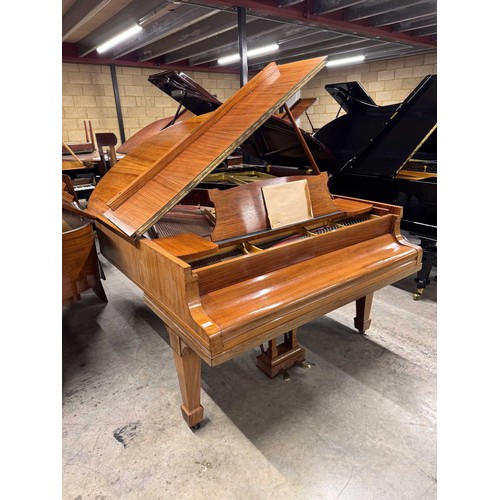 5 - Steinway (c1922)A 5ft 10in Model O grand piano in a rosewood case on square tapered legs; together w... 