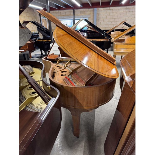 5 - Steinway (c1922)A 5ft 10in Model O grand piano in a rosewood case on square tapered legs; together w... 