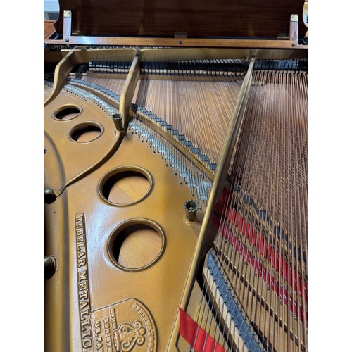 5 - Steinway (c1922)A 5ft 10in Model O grand piano in a rosewood case on square tapered legs; together w... 