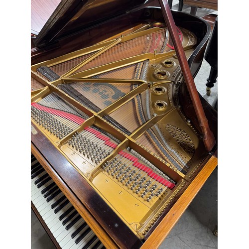 14 - Steinway (c1912)A 6ft 11in Model B grand piano in a rosewood case on square tapered legs; together w... 