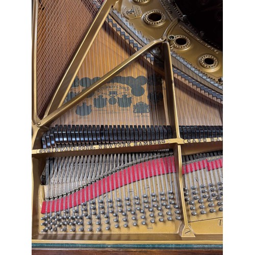 14 - Steinway (c1912)A 6ft 11in Model B grand piano in a rosewood case on square tapered legs; together w... 