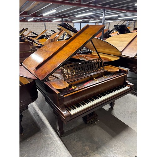 14 - Steinway (c1912)A 6ft 11in Model B grand piano in a rosewood case on square tapered legs; together w... 