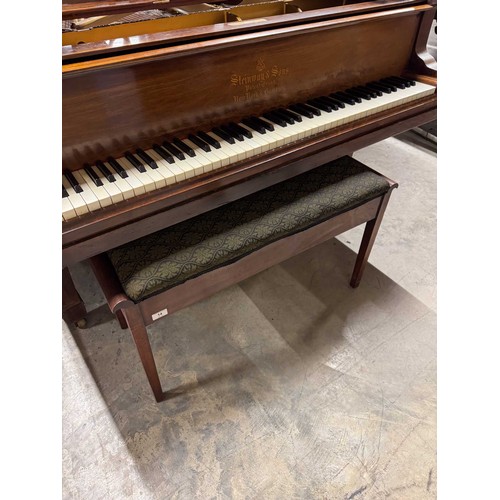 14 - Steinway (c1912)A 6ft 11in Model B grand piano in a rosewood case on square tapered legs; together w... 