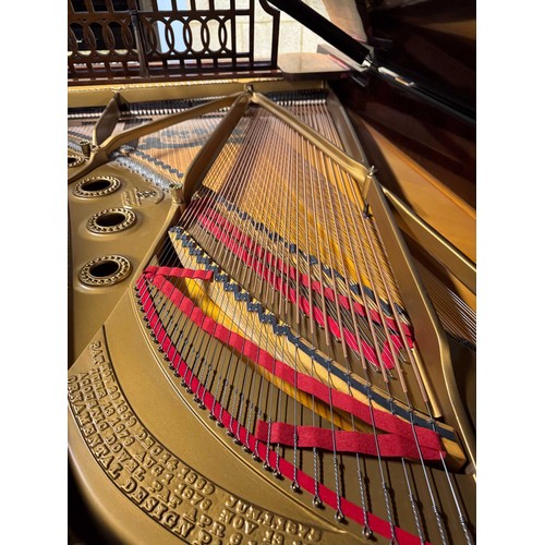 14 - Steinway (c1912)A 6ft 11in Model B grand piano in a rosewood case on square tapered legs; together w... 