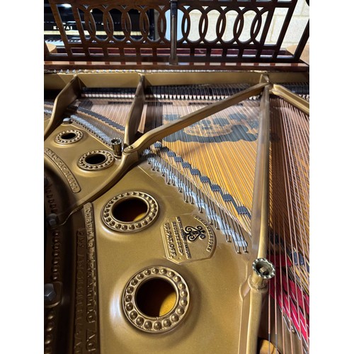 14 - Steinway (c1912)A 6ft 11in Model B grand piano in a rosewood case on square tapered legs; together w... 