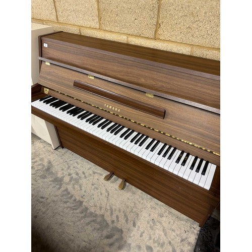 15 - Yamaha (c1996)A Model E108 upright piano in a walnut case; once the property of Paul Arthurs of Oasi... 