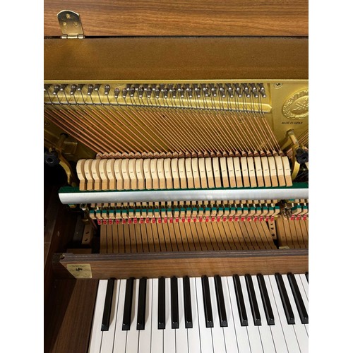 15 - Yamaha (c1996)A Model E108 upright piano in a walnut case; once the property of Paul Arthurs of Oasi... 