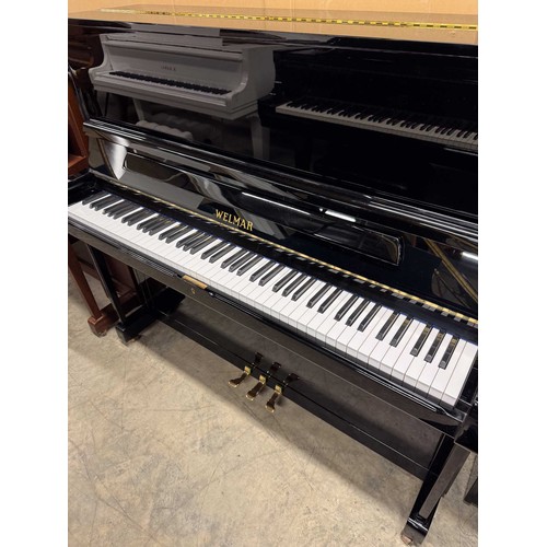 17 - Welmar (c1987)A Model 126 upright piano in a bright ebonised case.