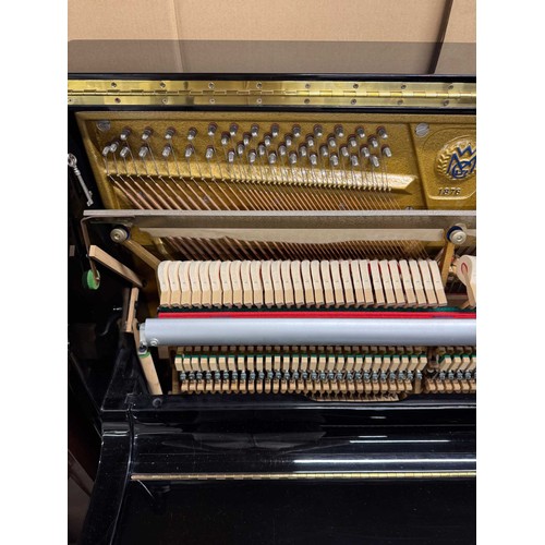 17 - Welmar (c1987)A Model 126 upright piano in a bright ebonised case.