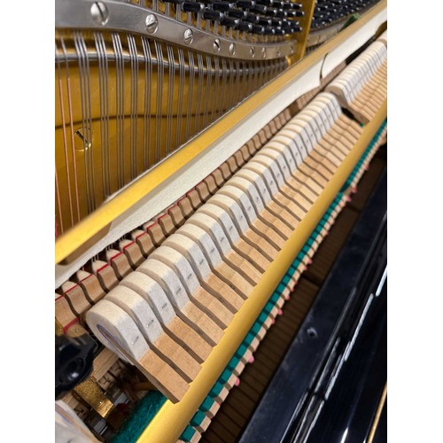 21 - Yamaha (c1977)A Model U3H upright piano in a traditional bright ebonised case.