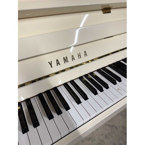 22 - Yamaha (c2005)A Model P112N upright piano in a modern bright white case; together with a stool.... 