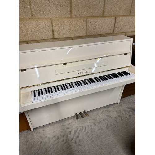 22 - Yamaha (c2005)A Model P112N upright piano in a modern bright white case; together with a stool.... 