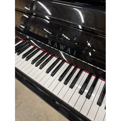 23 - Kawai (c2000s)A recent Model KU-120P upright piano in a bright ebonised case.