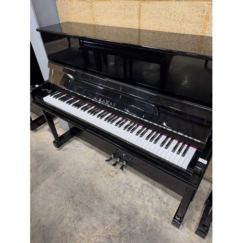 23 - Kawai (c2000s)A recent Model KU-120P upright piano in a bright ebonised case.