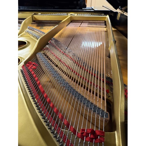 28 - Yamaha (c1977)A 6ft 1in Model C3 grand piano in a bright ebonised case on square tapered legs.