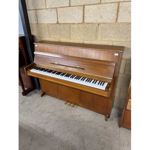 33 - AstorA recent modern upright piano in a walnut case.