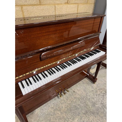 44 - Blüthner (c2006)A Model A upright piano in a traditional bright mahogany case.