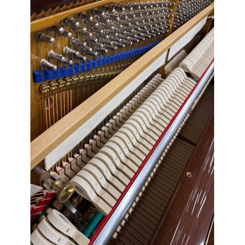 44 - Blüthner (c2006)A Model A upright piano in a traditional bright mahogany case.