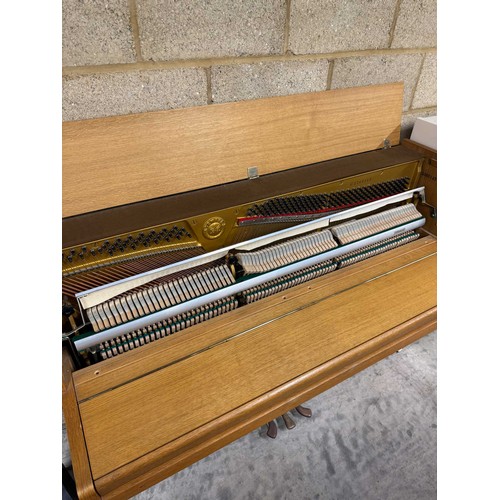 46 - *Yamaha (c1976)An upright piano in a modern style teak case. There is VAT on this Lot.