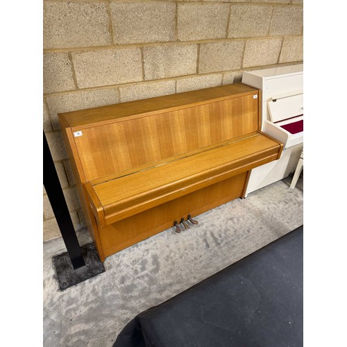 46 - *Yamaha (c1976)An upright piano in a modern style teak case. There is VAT on this Lot.