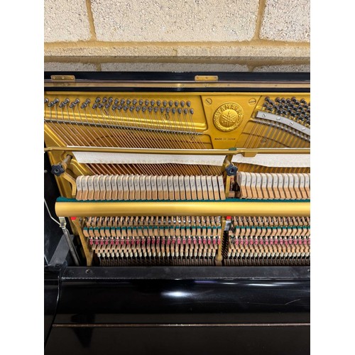 51 - Yamaha (c1977)A Model U1 upright piano in a bright ebonised case; together with a stool. AMENDMENT I... 