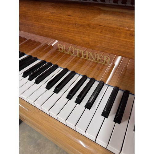 52 - Blüthner (c1976)A 6ft 3in Model 6 grand piano in a bright mahogany case on square tapered legs; toge... 