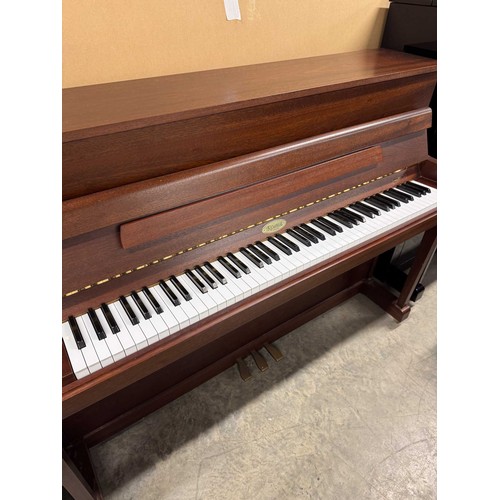 59 - Kemble (c1998)A Model Oxford upright piano in a satin mahogany case; together with a duet stool.... 