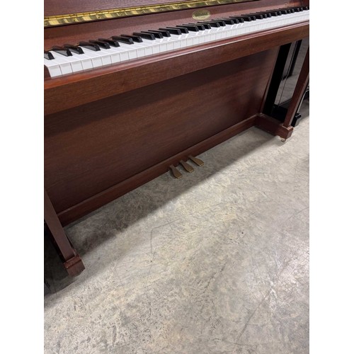 59 - Kemble (c1998)A Model Oxford upright piano in a satin mahogany case; together with a duet stool.... 