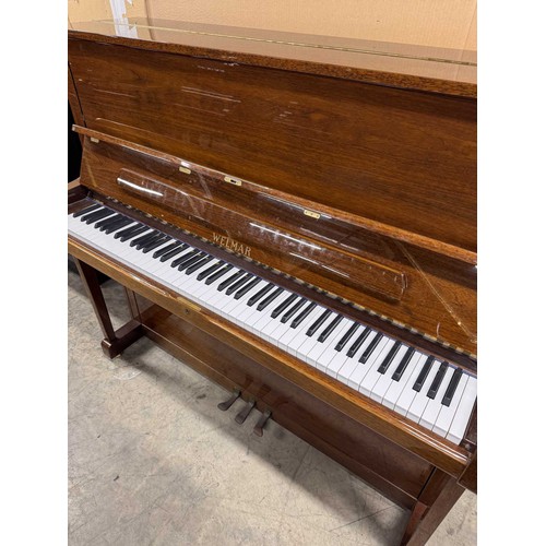 63 - Welmar (c1997)An upright piano in a traditional bright mahogany case; together with a stool.