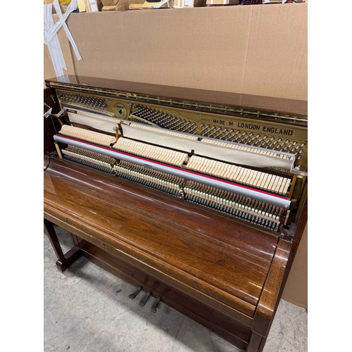 63 - Welmar (c1997)An upright piano in a traditional bright mahogany case; together with a stool.