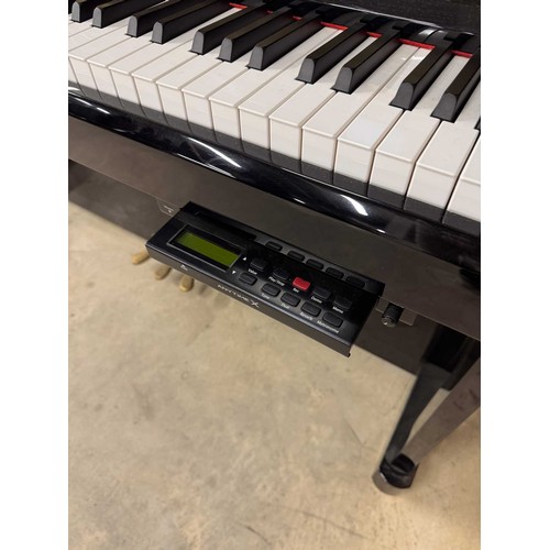 66 - Kawai (c2014)A Model K2-ATX upright piano in a traditional bright ebonised case. This instrument has... 