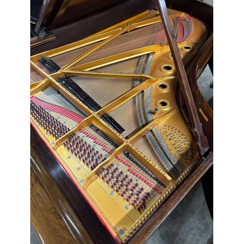 67 - Steinway (c1880)A 6ft 11in Model B grand piano in a rosewood case on turned elephant legs. This inst... 