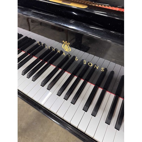 70 - Steinway (c1971)A 6ft 11in Model B grand piano in an ebonised case on square tapered legs.