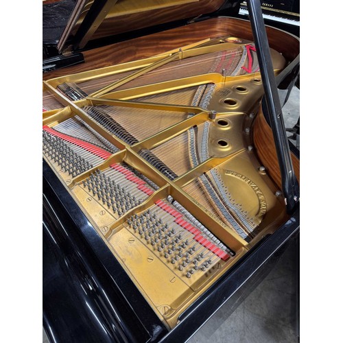 70 - Steinway (c1971)A 6ft 11in Model B grand piano in an ebonised case on square tapered legs.