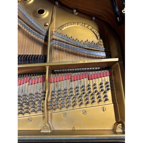 70 - Steinway (c1971)A 6ft 11in Model B grand piano in an ebonised case on square tapered legs.