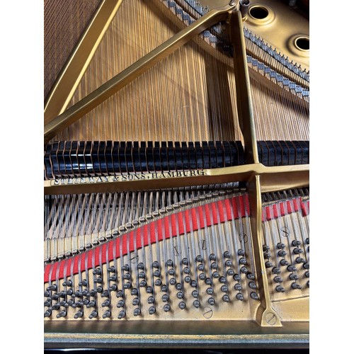 70 - Steinway (c1971)A 6ft 11in Model B grand piano in an ebonised case on square tapered legs.