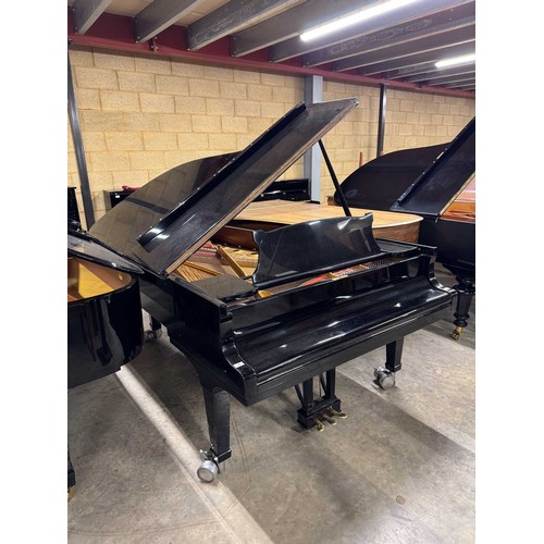 70 - Steinway (c1971)A 6ft 11in Model B grand piano in an ebonised case on square tapered legs.