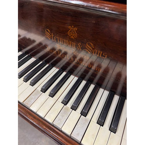 77 - Steinway (c1898)A 5ft 10in Model O grand piano in a rosewood case on turned and reeded legs; togethe... 