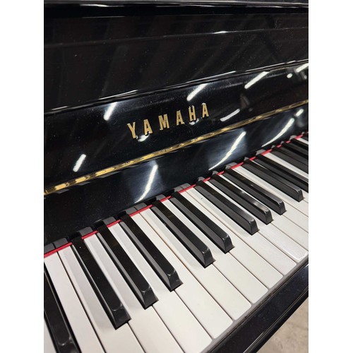 78 - Yamaha (c1973)A Model B1 modern upright piano in a bright ebonised case.