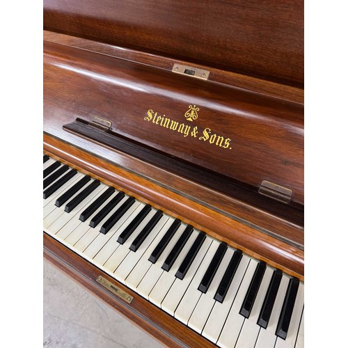 82 - Steinway (c1904)A Model K upright piano in a mahogany case. AMENDMENT Is in a rosewood case. IRN: 17... 