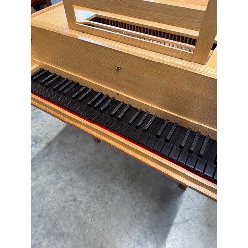 87 - HarpsichordA 7ft modern harpsichord in a light oak case supported on square sectioned legs. AMENDMEN... 