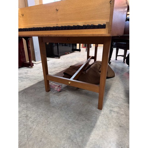 87 - HarpsichordA 7ft modern harpsichord in a light oak case supported on square sectioned legs. AMENDMEN... 