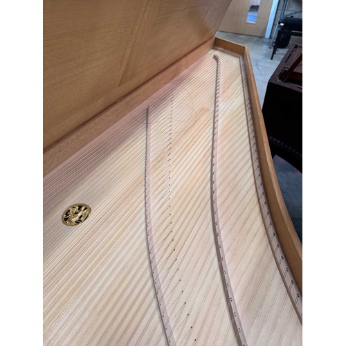 87 - HarpsichordA 7ft modern harpsichord in a light oak case supported on square sectioned legs. AMENDMEN... 