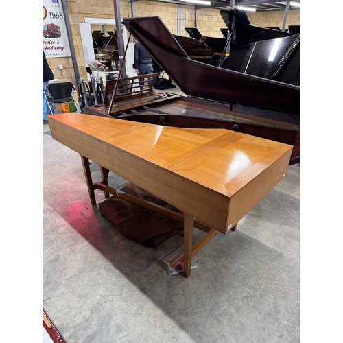 87 - HarpsichordA 7ft modern harpsichord in a light oak case supported on square sectioned legs. AMENDMEN... 