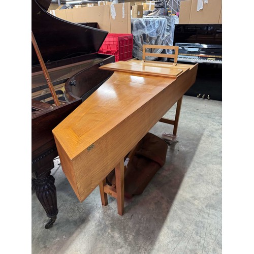 87 - HarpsichordA 7ft modern harpsichord in a light oak case supported on square sectioned legs. AMENDMEN... 