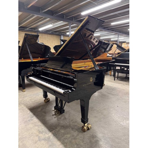 90 - Steinway (c2004)A 9ft Model D concert grand in a bright ebonised case on square tapered legs.