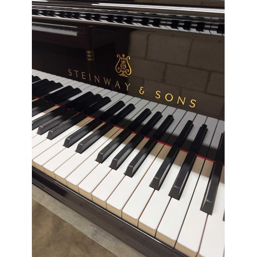 90 - Steinway (c2004)A 9ft Model D concert grand in a bright ebonised case on square tapered legs.