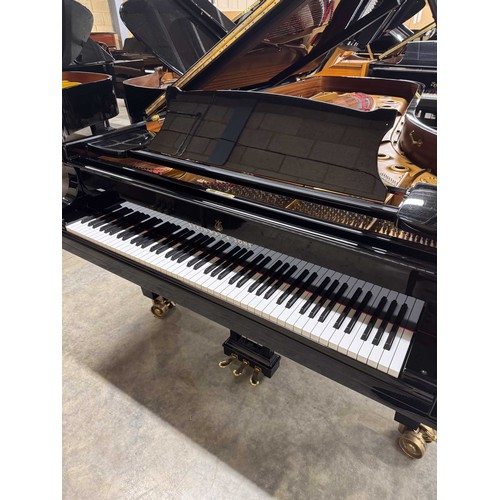 90 - Steinway (c2004)A 9ft Model D concert grand in a bright ebonised case on square tapered legs.