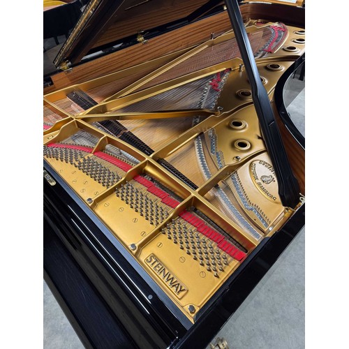 90 - Steinway (c2004)A 9ft Model D concert grand in a bright ebonised case on square tapered legs.